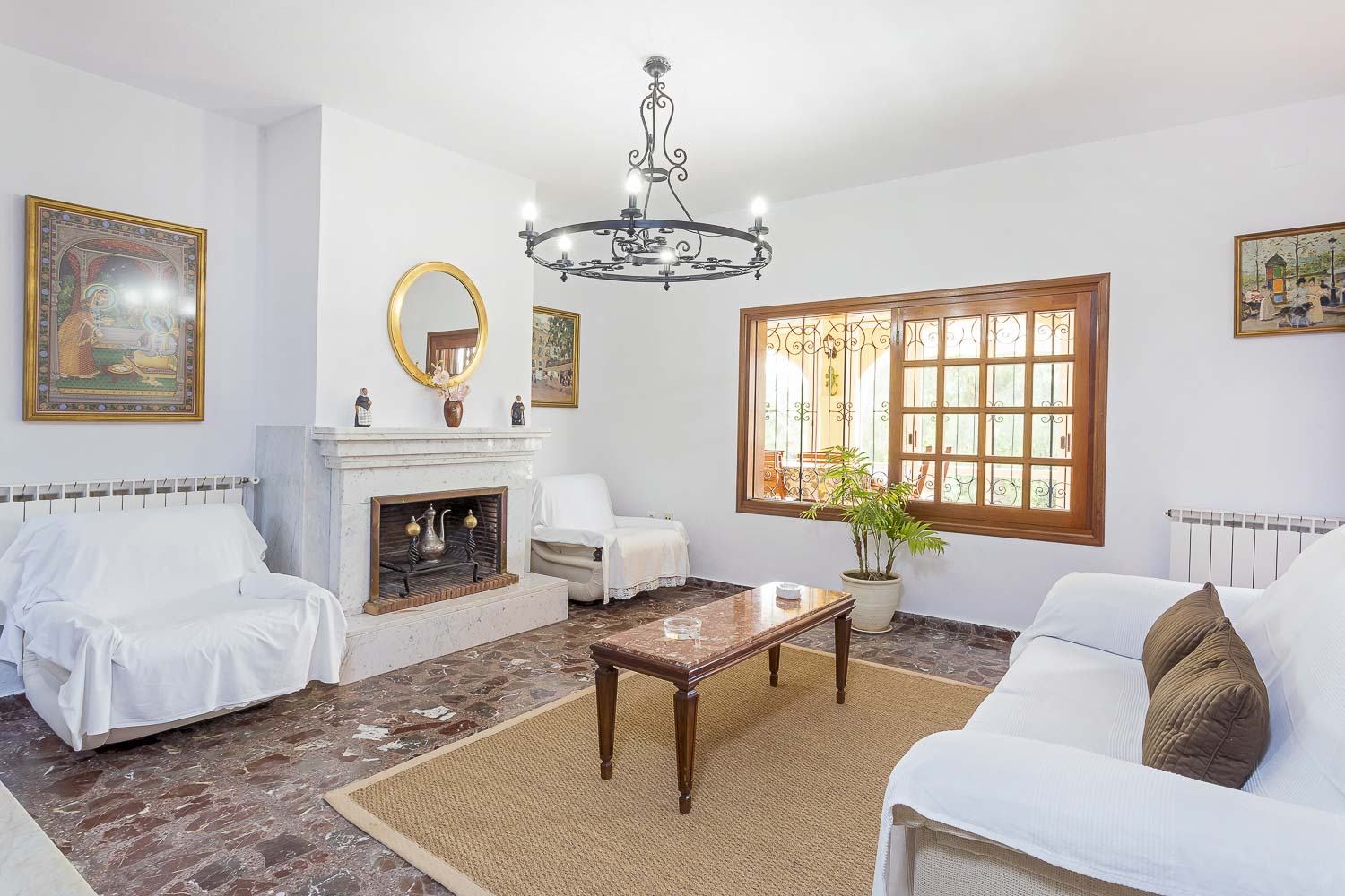 interior living room with fireplace of a rental house in ibiza with